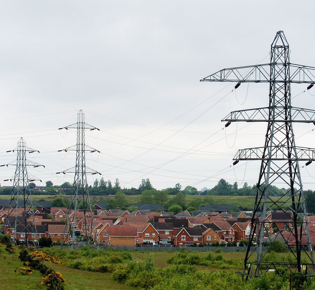 BIRMINGHAM, UNITED KINGDOM- JUNE 3:  Pylons are seen situated over a residential housing area on June 3, 2005 in Birmingham, England. Research released suggests that living too close to overhead powerlines apears to cause a higher risk in childhood leukaemia. The study concluded that children who lived within 200m of high voltage lines were at 70% higher risk. (Photo by Matt Lewis/Getty Images)