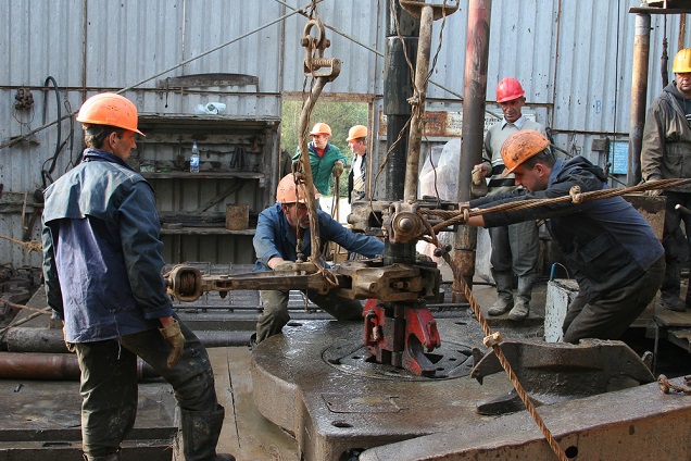 Men working oil
